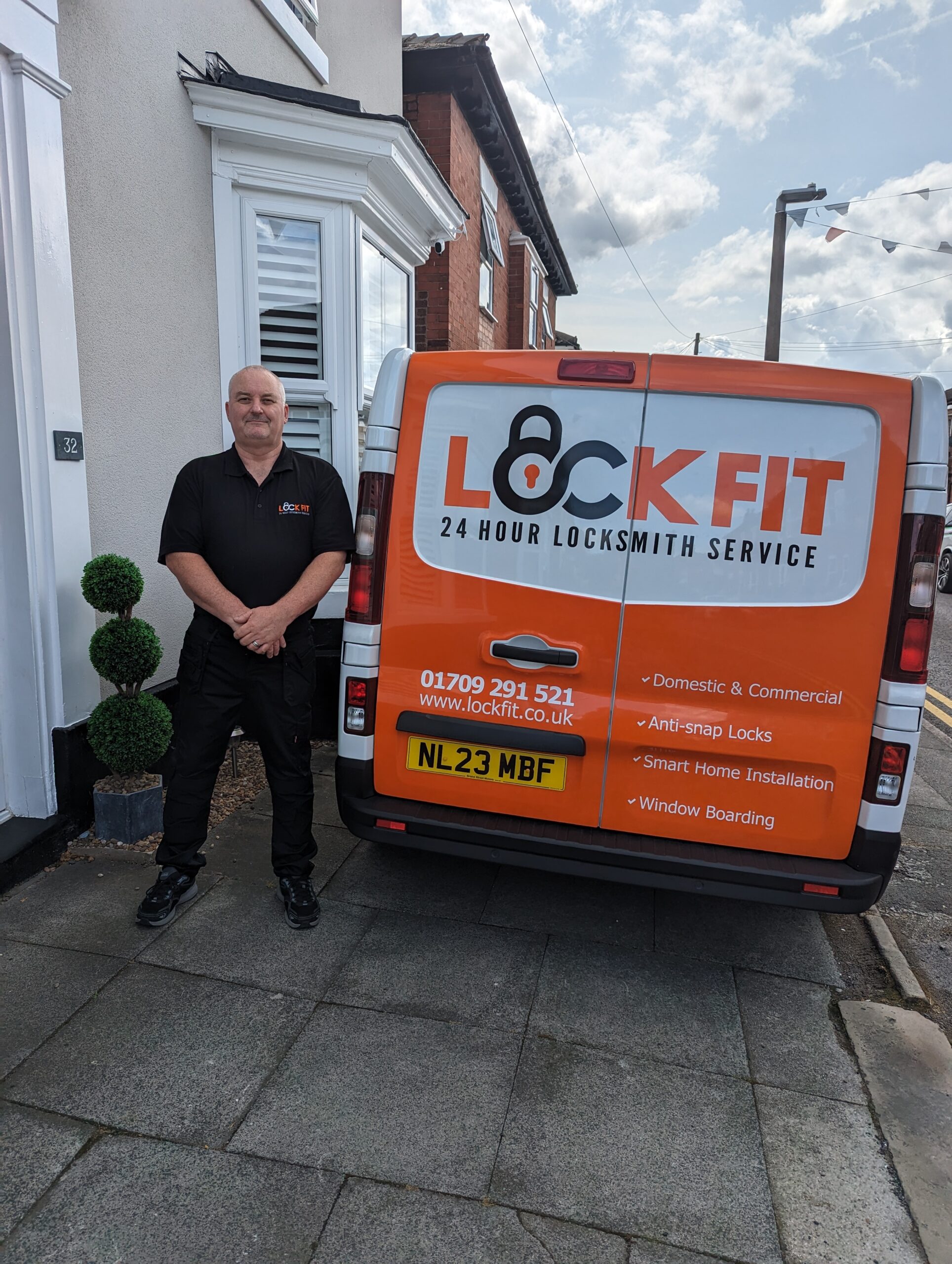 Locksmith engineer working on a door lock